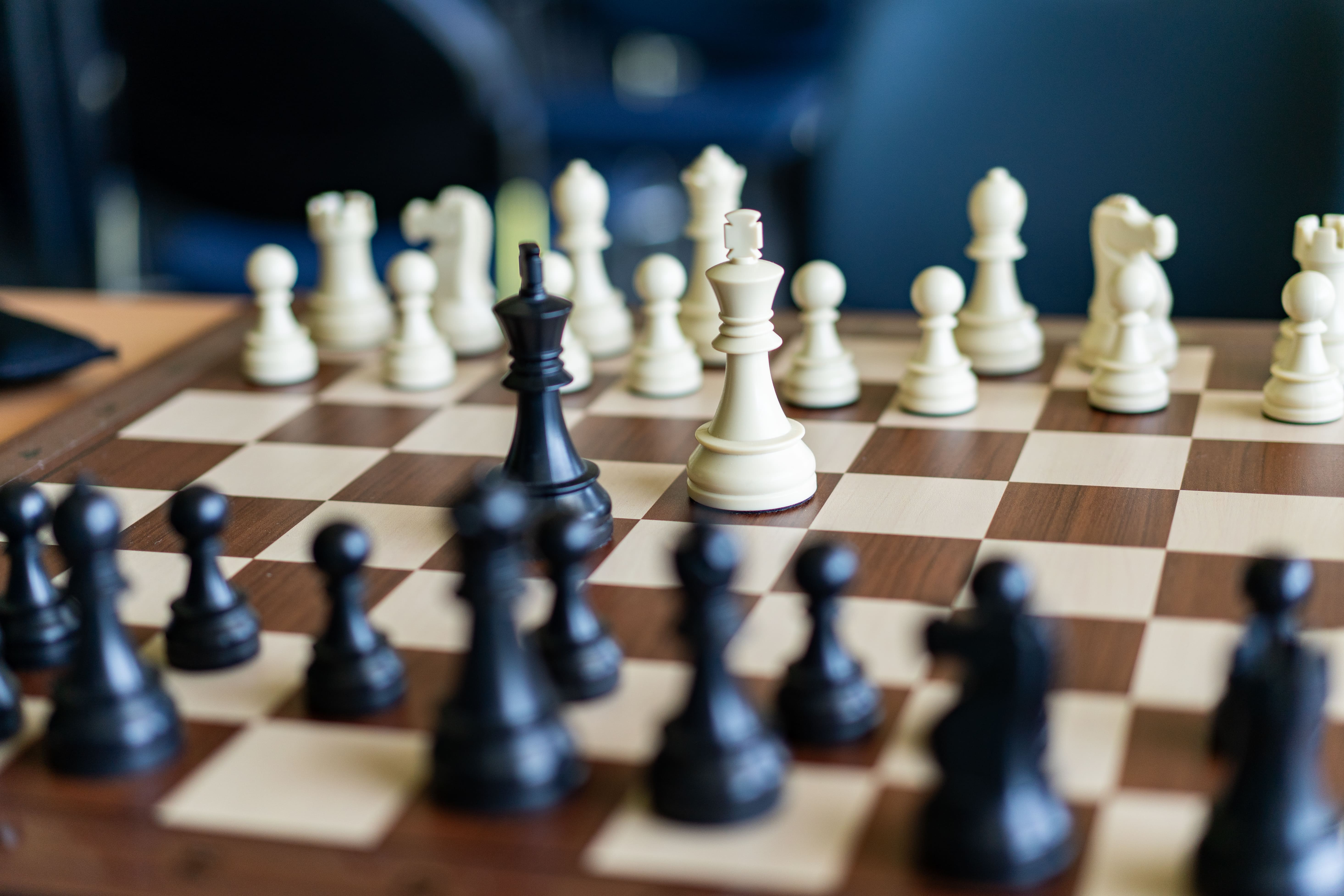 Close-up of chess pieces mid-game